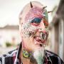 Parrot Man of the world - Made Colorful Tattoo on his body to look like a parrot