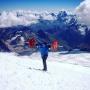 A russian mountaineer climbs 5500 feet mountain carrying 75 kg of weight
